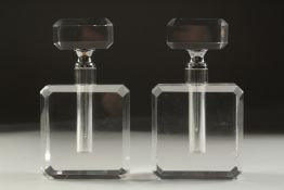 A PAIR OF ART DECO STYLE CLEAR GLASS SCENT BOTTLES. 5.5ins high.