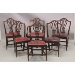 A SET OF SIX HEPPLEWHITE DESIGN SHIELD BACK DINING CHAIRS one with arms, with leather drop in