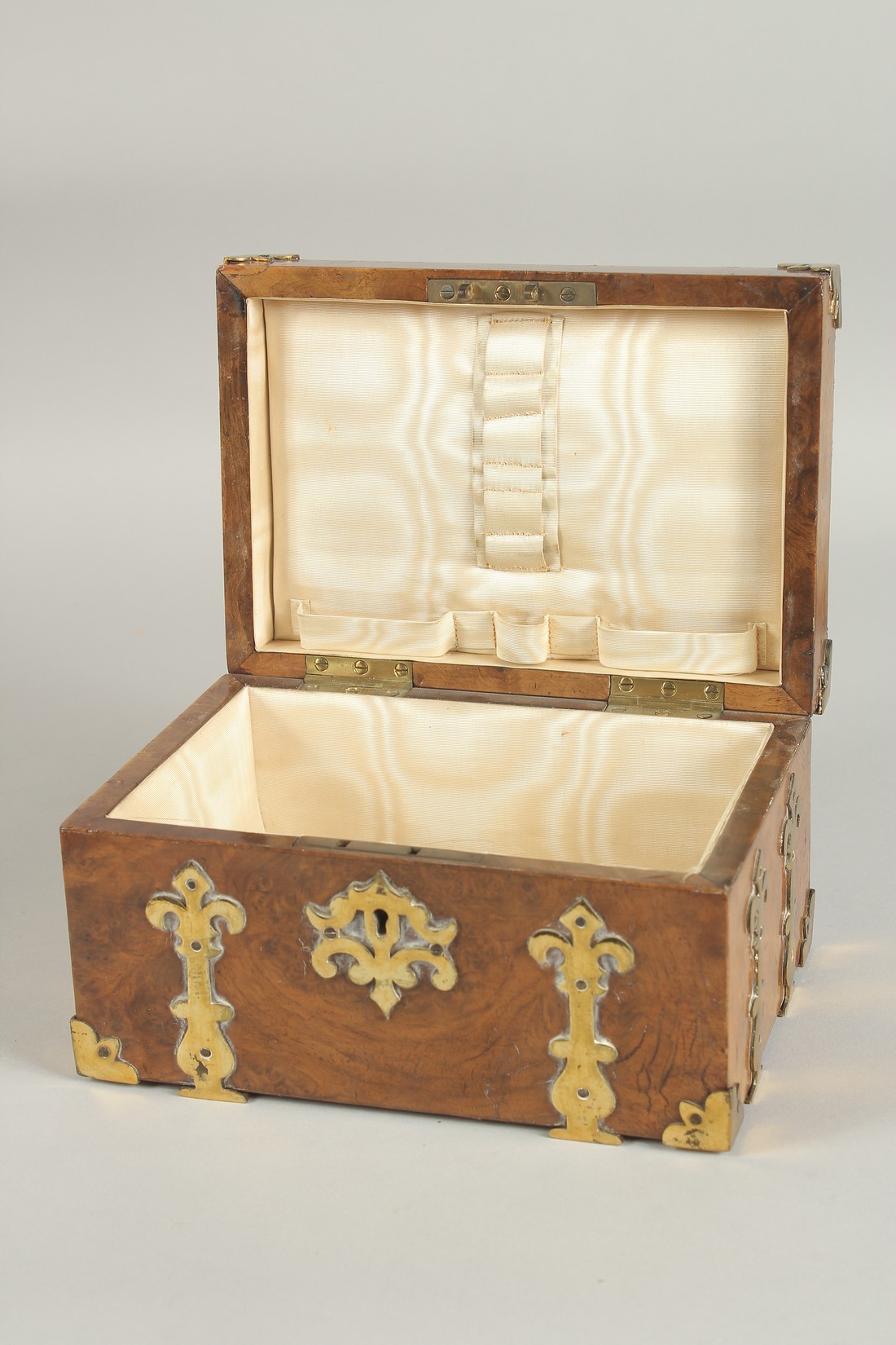 A GOOD 19TH CENTURY FIGURED WALNUT BRASS BOUND CASKET with velvet interior. 8ins long. - Image 2 of 3