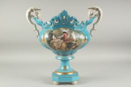A SEVRES STYLE LIGHT BLUE TWO HANDLED PORCELAIN VASE with reverse panels of figures. 1ft 4ins high.