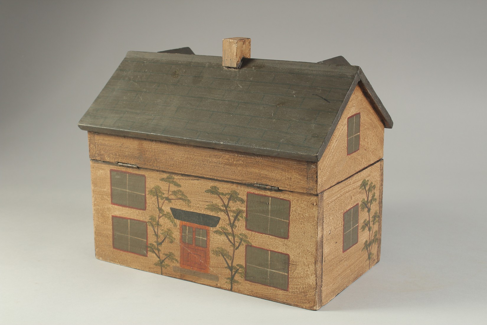 A DECORATIVE PAINTED BOX OR TEA CADDY, modelled as a cottage. 10ins long. - Image 2 of 3