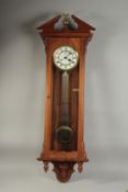 A VICTORIAN MAHOGANY HANGING WALL CLOCK with white dial, Roman numerals and brass pendulum with