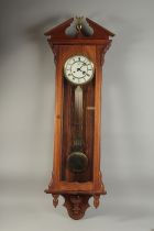 A VICTORIAN MAHOGANY HANGING WALL CLOCK with white dial, Roman numerals and brass pendulum with