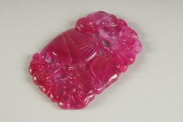 A CARVED CHINESE PINK TOURAMALINE PIERCED PENDANT. 2.75ins x 1.75ins.