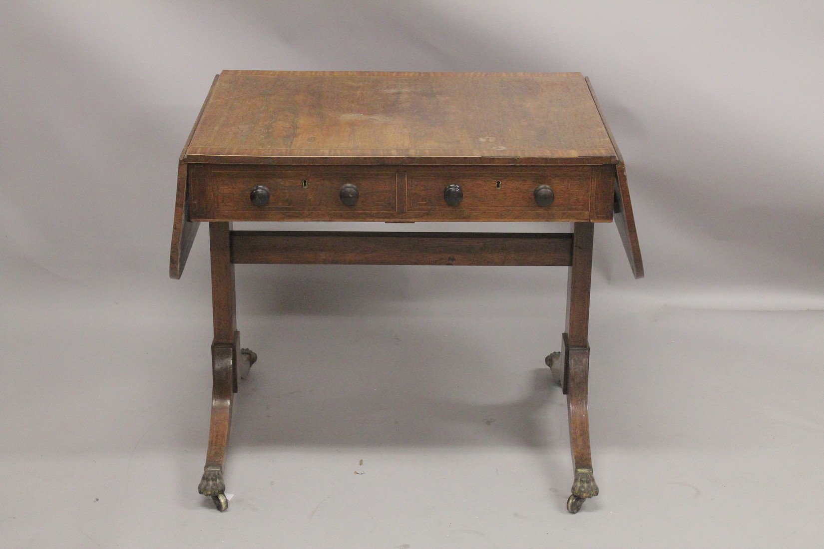 A REGENCY ROSEWOOD SOFA TABLE with folding flaps, on curving legs with casters. 4ft 4ins long - Image 3 of 4