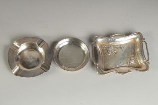 A SMALL ART DECO SILVER TWO HANDLED TRAY, 4ins long. Brimingham 1906 and TWO SMALL TRAYS (3).
