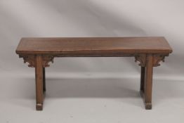 A LONG LOW CHINESE TABLE. 4ft 2ins long, 1ft 9ins high.