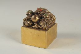 A CHINESE BRONZE SQUARE SEAL with dragons. 2.75ins .