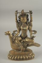 A CHINESE BRONZE TARA FIGURE. 9.5ins high.