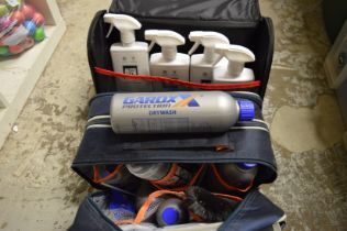 Two cases containing car cleaning equipment.