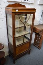 A mahogany display cabinet.