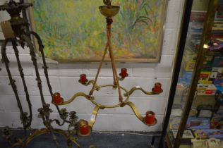 A brass six branch chandelier.