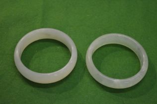 Two jade bangles.