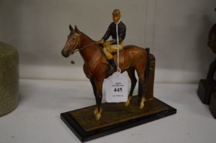 A painted Spelter table lighter modelled as a horse and jockey.