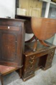 An old corner cupboard, dining chair, desk and drop-leaf table.
