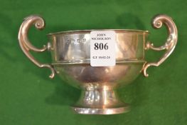 A silver twin handled pedestal cup.