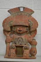 A large pre Colombian style painted pottery seated figure.