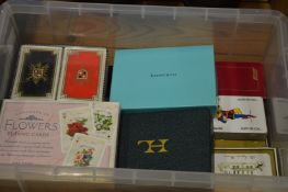 A quantity of boxed playing cards.