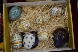 Porcelain egg shaped boxes and similar items.