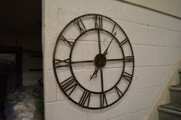 A large metal wall clock.