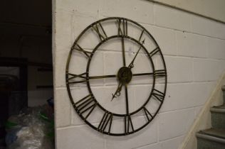 A large metal wall clock.