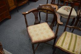 An Edwardian inlaid mahogany corner armchair and four other chairs.