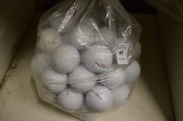 A bag of fifty Pinnacle golf balls.