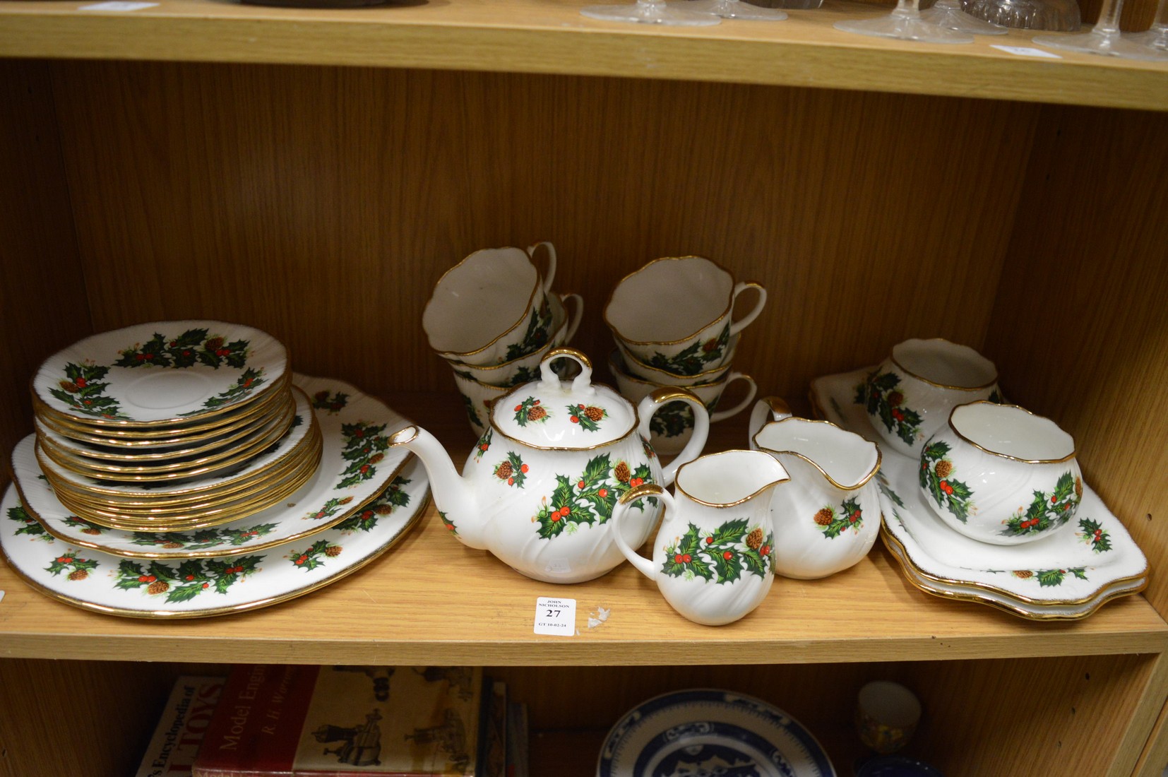 A quantity of Queens China Yuletide pattern dinner and tea ware.