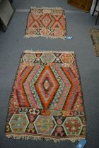 Two small Kelim rugs 130cm x 90cm and 125cm x 88cm.