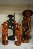 A collection of Chinese carved wood figures.