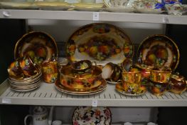 A Quantity of fruit decorated dinnerware.