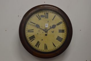 A mahogany cased circular wall clock.