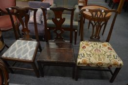 Three various dining chairs.