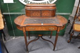 A Victorian inlaid rosewood writing desk.