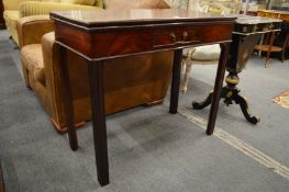 A 19th century mahogany rectangular fold-over tea table with a single frieze drawer on moulded