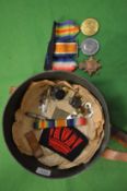 A set of three named WWI medals for J8054 F W Stammers A.B.R.N. and other items.