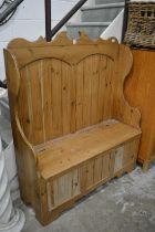 A pine high back settle.