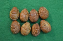 A group of small carved wood okimono's.