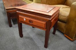A pair of Chinese red wood single drawer lamp tables.