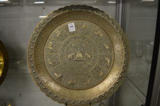 An Indian embossed and engraved white metal dish.
