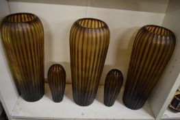 Five stylish amethyst glass vases.