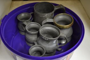 A small group of pewter tankards.