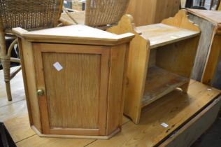 A small pine shelf and hanging corner cupboard.