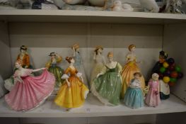 A collection of Doulton and other figurines.