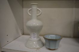 A small Chinese blue glazed bowl and a blanc de chine incense stick holder.