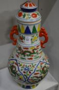 A large Chinese Wucai polychrome decorated baluster shaped vase and cover.
