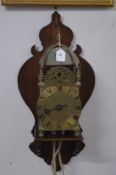 A good 18th century brass lantern clock on later wall bracket.