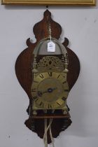 A good 18th century brass lantern clock on later wall bracket.