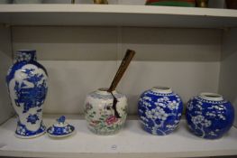 Chinese blue and white baluster shaped vase and cover together with three ginger jars.