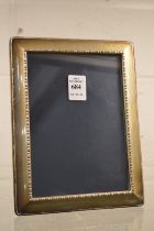 A silver photograph frame, photo size 6¾" x 4¾".